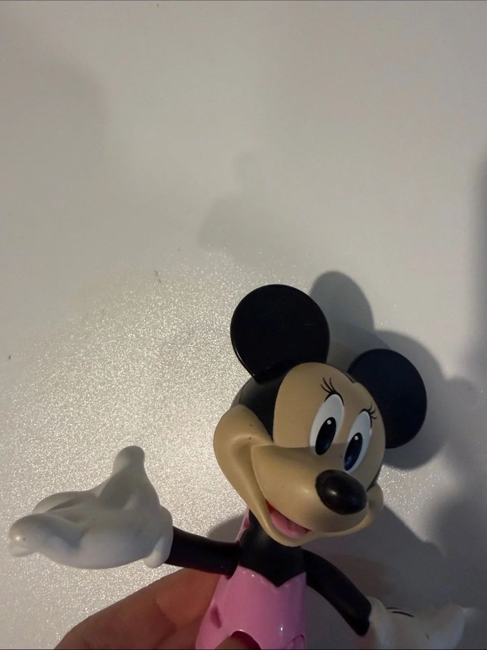 Minnie Mouse with push button arms and head figurine